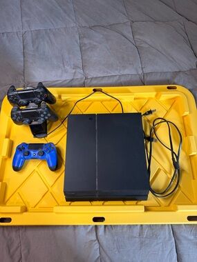 Sony Black PlayStation 4 Console with Black and Blue Controllers